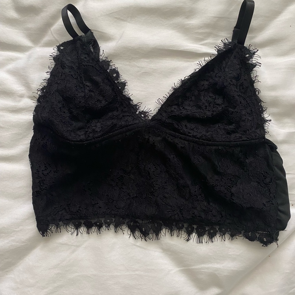 Black going out top with lace detailing size small.